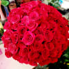 135 premium roses arranged in a black  container. Compact design.