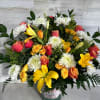 NICE ARRANGEMENT IN ORANGE AND YELLOW COLORS, WITH A MIX OF FLOWERS