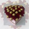 RED ROSES AND FERRERO CHOCOLATES COVER A HEART SHAPE BOX. BEUTIFUL ARRANGEMENT