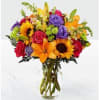 Beautiful fall flowers. This arrangement including with Sunflowers, Lily, Roses, Stock. 