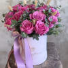 Fuschia pink flower bouquet nestled in a cylinder keepsake box to include