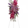 A standing spray featuring  pink roses, oriental lilies and gladioli blend