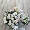 Celebrate the arrival of spring with this vibrant arrangement featuring stunning lilies