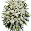 Stunning in its simplicity, this gorgeous spray of white roses and lilies