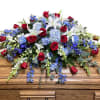 A colorful tribute for someone special, this brilliant spray of red, white