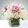 Classic and Beautiful, this large arrangement whispers luxury. Soft pinks, whites and