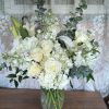 A lovely bouquet to soothe and comfort, a variety of white and