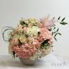 A classy, simple yet gorgeous arrangement with a touch of feather and