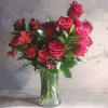 A simple yet beautiful arrangement in a vase with Premium Red roses