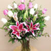 12 Roses (Pink and White) and Pink Lilies arrive beautifully arranged in