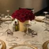 Roses in a gold vase.