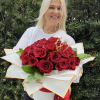 Amazing arrangement of red roses with crown on top in a box