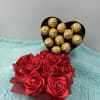 A combination of eternal roses with some chocolate to show your person