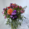 Celebrate good times with this lively bouquet. The arrangement includes roses, alstroemeria