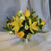 Arrangement contains yellow lilies, yellow rose and white lisianthus in a gold