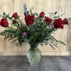 Enjoy a large and full vase arrangement with gorgeous, fillers greens and