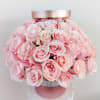 Rose gold cylinder gift box with jewel cuff accent filled with three