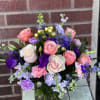 Designed by one of our local girls, this soft arrangement in peaches