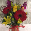 bright and colorful with lilies, roses, stock and gerber daisy