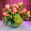 Peach Roses, Green, Yellow Alstromerias with filler arranged in a bubble clear