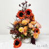 A gorgeous combination of sunflowers, peonies, roses and green leaves in a