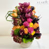 Brighten up someone&#039;s day with this colorful arrangement of cymbidium orchids, roses