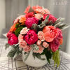 Gift this arrangement of peonies mixed with roses in a ceramic pot