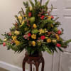Floral urn to stand beside casket, made with sunflowers, lilies, roses, green