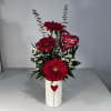 3 Gerbera Daisies in a White Ceramic Vase with a Red Heart
