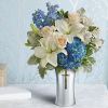 Featuring four hand-made sympathy pieces, this breathtaking collection of sky blue and