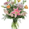 This flirty mix of pink and peach blossoms, mixed with greenery and