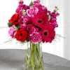 Fuchsia Stock, hot pink Carnations, red Roses, fuchsia Gerbera Daisies and greens