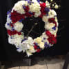 Patriotic red, white and blue wreath standing spray 
*Pricing does not include