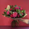This is a hand tied bouquet that has imported Ecuadorian roses and
