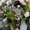 The Rustic Elegance floral arrangement is a sublime and sophisticated display that