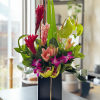 The modern tropical floral arrangement is a stunning and contemporary display of