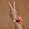 A pretty wrist corsage for special occasions. Created with fresh flowers and