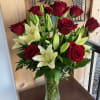 Twelve beautiful long stem Roses coupled with Lilys is a great way