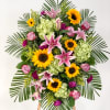 A bright and beautifully scented standing spray to remember and celebrate the