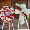 This Complete Funeral Package includes 3 standing sprays in any style and