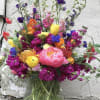 This beauty is bursting with color and wild blooms, just like you
