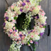 This design includes Hydrangea, Mini Green Hydrangea, Roses, Spray Roses, Lisianthius, Lily&#039;s