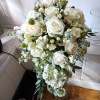 beautiful white roses, stuck and other white fillers with greens