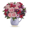 Gorgeous roses and a ceramic pitcher with dragonfly. This pink-tastic is a