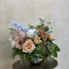 Relaxed but still striking, this classy arrangement includes hydrangea, roses, tulips, and