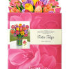 Stunning paper floral bouquet pops open and brings color to any room.