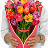 Stunning paper floral bouquet pops open and brings color to any room.