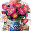 Stunning paper floral bouquet pops open and brings color to any room.