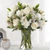 Honor the memory of your loved one with soft ivory roses, alstromeria