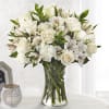 Honor the memory of your loved one with soft ivory roses, alstromeria
